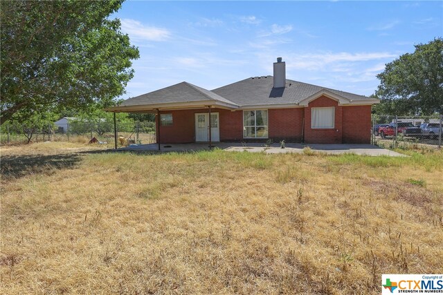 1074 Fm 3219, Harker Heights, TX 76548 - rear view of property featuring a patio area, a chimney, and brick siding