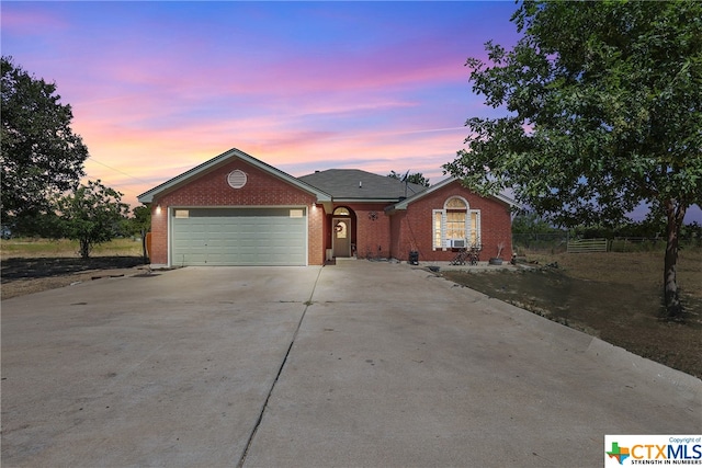 ranch-style home with a garage