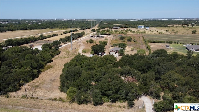 birds eye view of property featuring a rural view