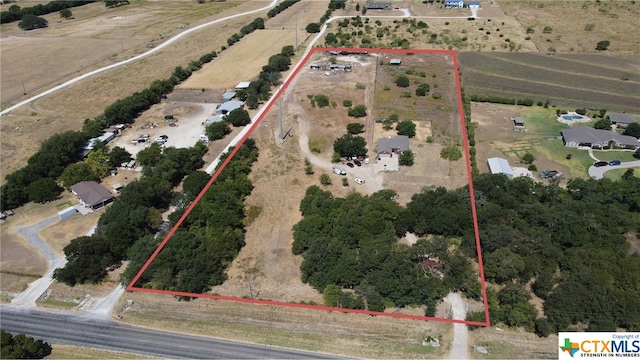 birds eye view of property featuring a rural view