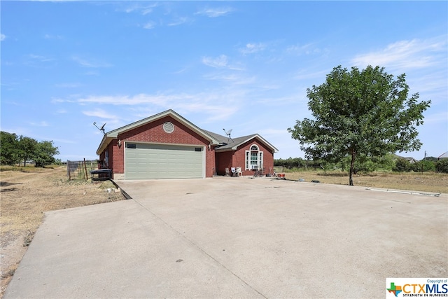 ranch-style home featuring a garage