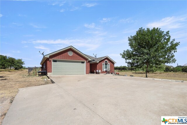 1074 Fm 3219, Harker Heights, TX 76548 - ranch-style house featuring brick siding, an attached garage, and driveway