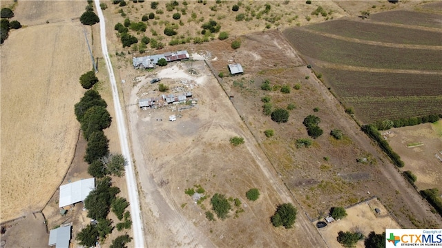 birds eye view of property featuring a rural view