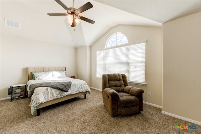 carpeted bedroom featuring ceiling fan and vaulted ceiling