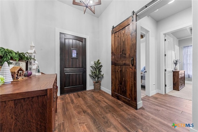 3004 Hester Way, Salado, TX 76571 - foyer entrance featuring dark wood-type flooring, a barn door, and baseboards