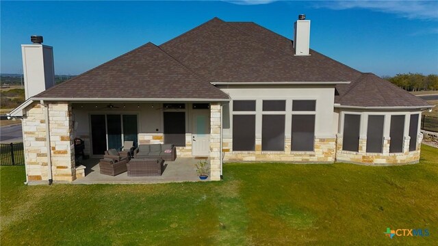 back of house featuring ceiling fan, a patio area, an outdoor hangout area, and a yard