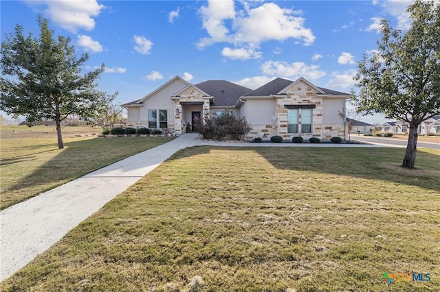 view of front of house with stone siding, a front lawn, and stucco siding