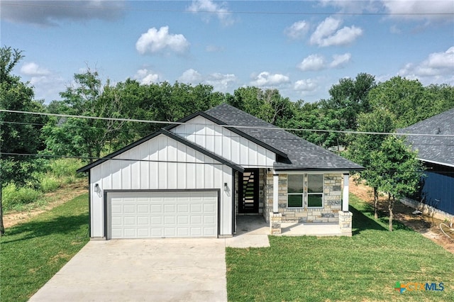 view of front facade with a front lawn and a garage