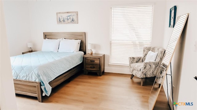 bedroom with light wood finished floors