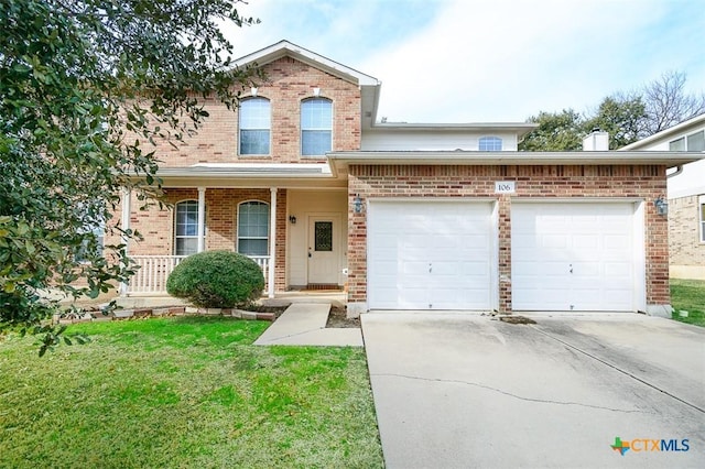 front facade with a garage and a front lawn