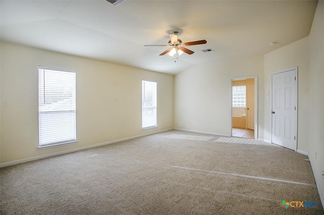 carpeted spare room with ceiling fan