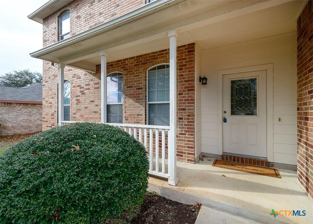 property entrance with a porch