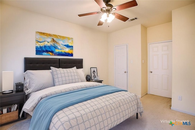 bedroom with ceiling fan and light colored carpet