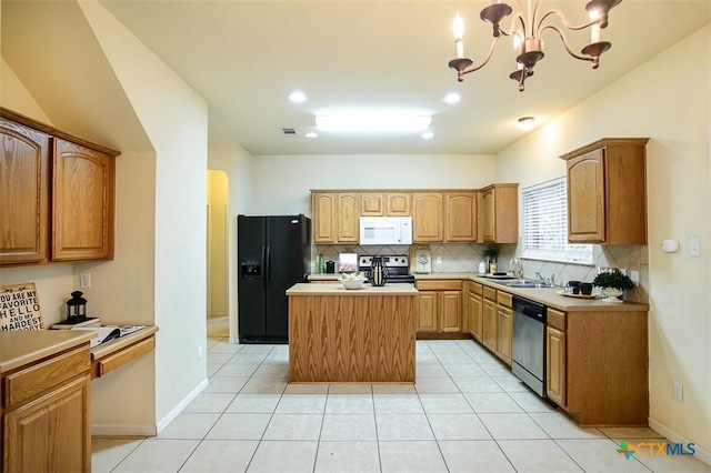 kitchen featuring stainless steel appliances, a center island, light tile patterned floors, and decorative backsplash