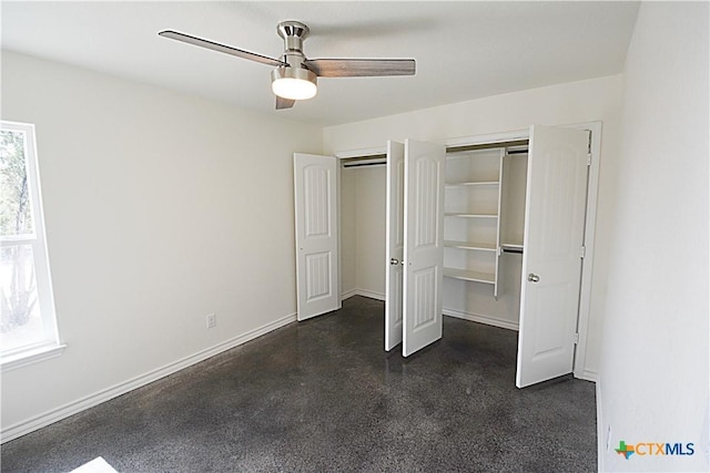 unfurnished bedroom featuring multiple closets and ceiling fan