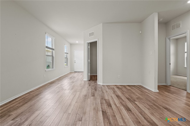 spare room with light hardwood / wood-style floors