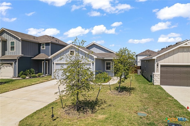 view of front of home with a garage and a front lawn