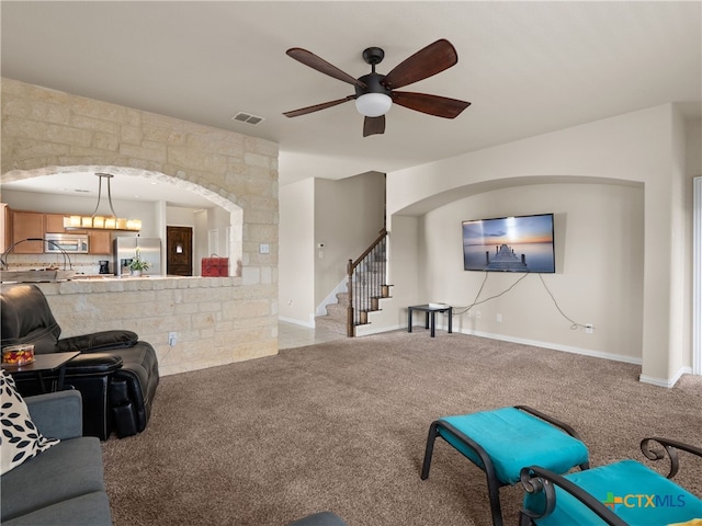 515 Secluded Grv, San Antonio, TX 78253 - living room with stairs, carpet, a ceiling fan, and baseboards