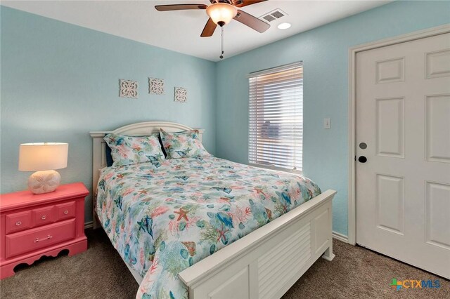 52 Fm 2031, Matagorda, TX 77457 - bedroom featuring dark carpet and a ceiling fan