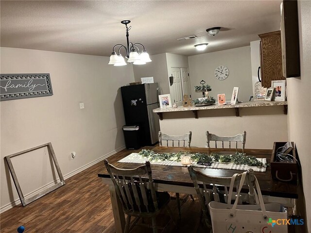 801AND803 S Live Oak St, Lampasas, TX 76550 - dining room with dark wood-style floors and a chandelier
