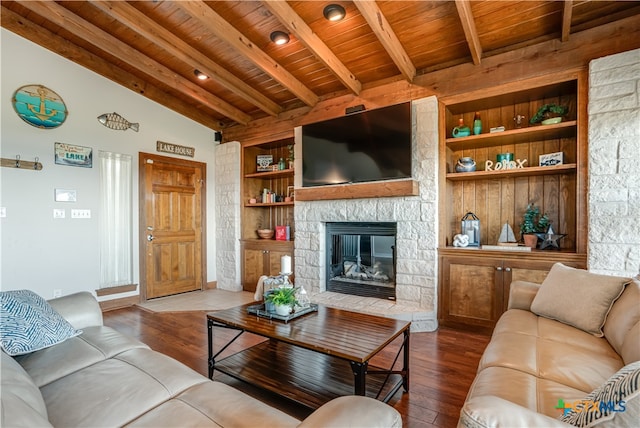 living room with hardwood / wood-style flooring, built in shelves, wooden ceiling, and a fireplace