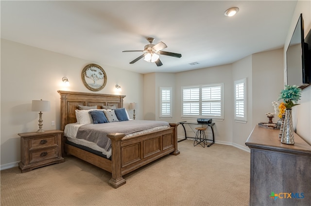 bedroom featuring ceiling fan and light colored carpet