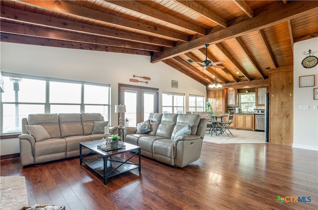 living room with french doors, vaulted ceiling with beams, hardwood / wood-style floors, wooden ceiling, and ceiling fan