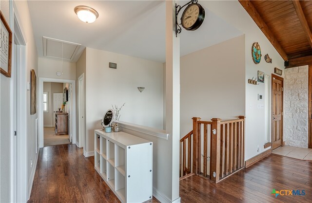 hallway featuring high vaulted ceiling, hardwood / wood-style flooring, wooden ceiling, and beam ceiling