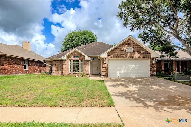 ranch-style home featuring a front lawn and a garage