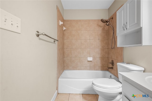 full bathroom with tile patterned flooring, vanity, toilet, and tiled shower / bath