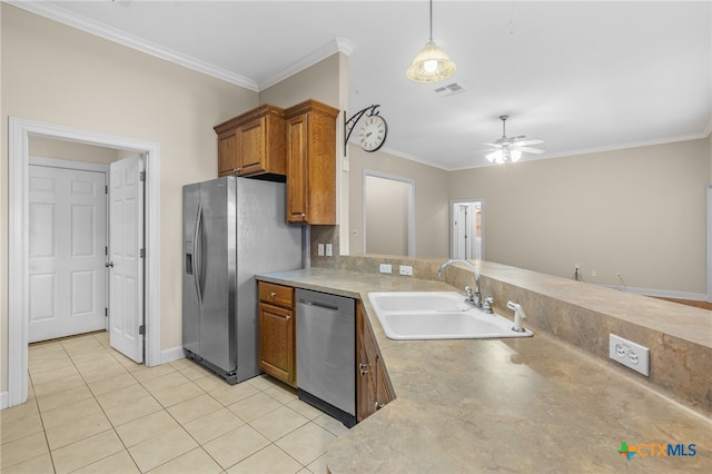 kitchen with ornamental molding, appliances with stainless steel finishes, sink, and ceiling fan