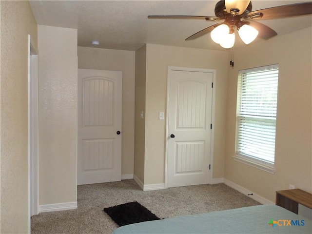 2807 Terrace Dr, Killeen, TX 76543 - unfurnished bedroom featuring carpet flooring, multiple windows, and ceiling fan