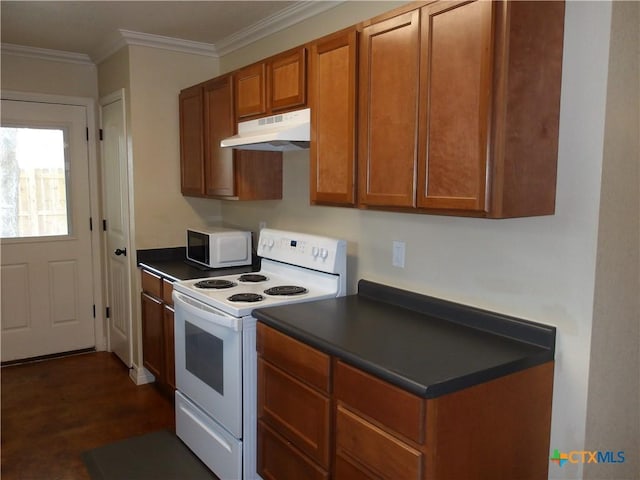 2807 Terrace Dr, Killeen, TX 76543 - kitchen with white appliances, under cabinet range hood, brown cabinets, dark countertops, and ornamental molding
