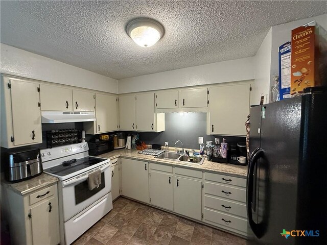 809 Michelle Dr, Copperas Cove, TX 76522 - kitchen featuring freestanding refrigerator, a textured ceiling, under cabinet range hood, a sink, and white electric stove