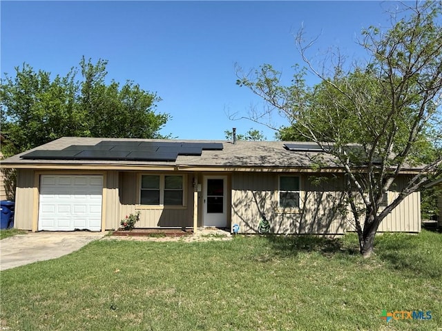 809 Michelle Dr, Copperas Cove, TX 76522 - single story home with concrete driveway, board and batten siding, an attached garage, a front lawn, and roof mounted solar panels