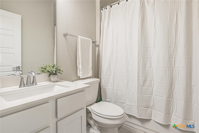 full bathroom with vanity, toilet, and shower / bath combo with shower curtain