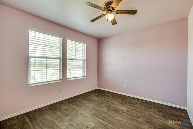 772 Armadillo Dr, Seguin, TX 78155 - spare room with baseboards, a ceiling fan, and dark wood-style flooring
