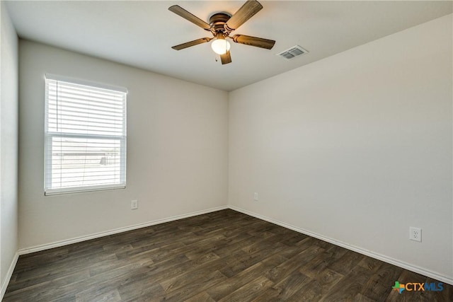 772 Armadillo Dr, Seguin, TX 78155 - unfurnished room featuring visible vents, baseboards, a ceiling fan, and dark wood-style flooring