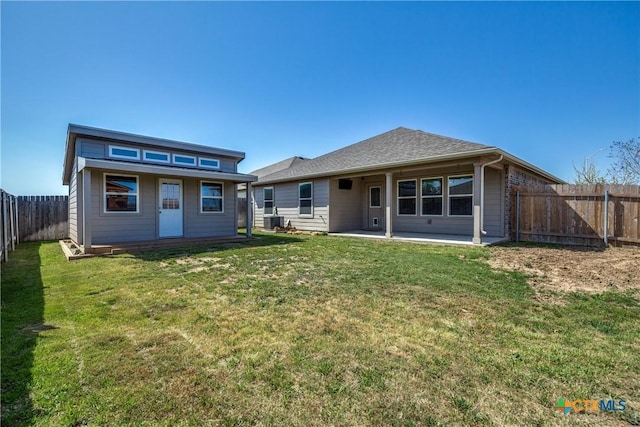 772 Armadillo Dr, Seguin, TX 78155 - back of property featuring a fenced backyard, an outdoor structure, a patio area, central air condition unit, and a lawn