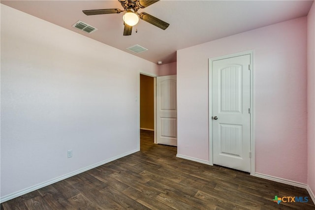 772 Armadillo Dr, Seguin, TX 78155 - unfurnished bedroom featuring visible vents, baseboards, ceiling fan, and dark wood-style flooring
