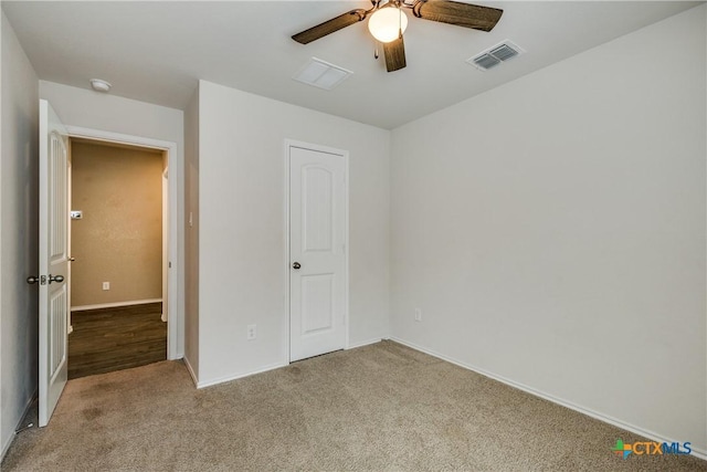 772 Armadillo Dr, Seguin, TX 78155 - unfurnished bedroom featuring visible vents, light colored carpet, and a ceiling fan