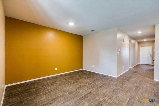 772 Armadillo Dr, Seguin, TX 78155 - spare room featuring visible vents, recessed lighting, baseboards, and wood finished floors
