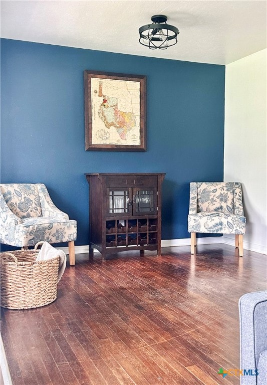 sitting room featuring wood finished floors and baseboards