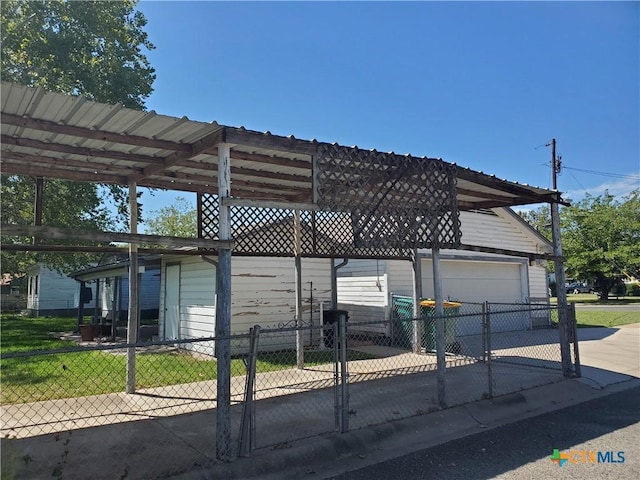 view of property exterior featuring fence and an outdoor structure