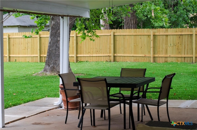 view of patio featuring outdoor dining area