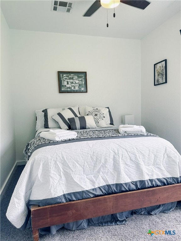 bedroom featuring carpet, a ceiling fan, and baseboards