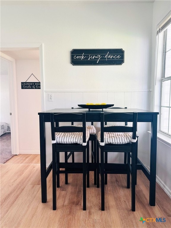 dining space featuring wood finished floors