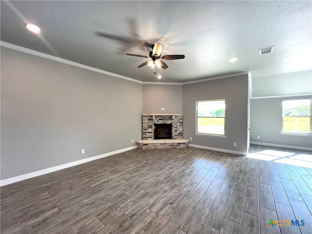 913 Antelope Trl, Temple, TX 76504 - unfurnished living room featuring ceiling fan, dark wood finished floors, baseboards, a brick fireplace, and ornamental molding