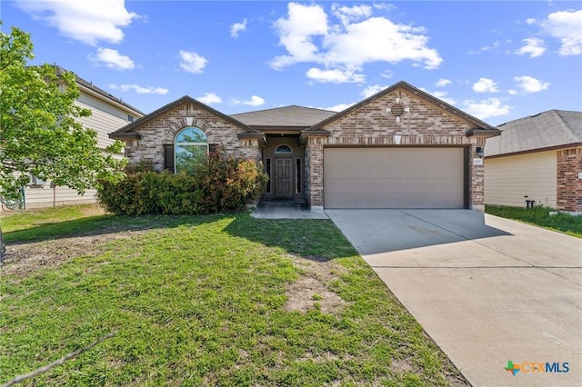 ranch-style home featuring brick siding, driveway, a front yard, and a garage