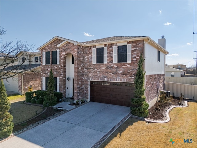 traditional-style home with a garage, brick siding, fence, driveway, and a chimney